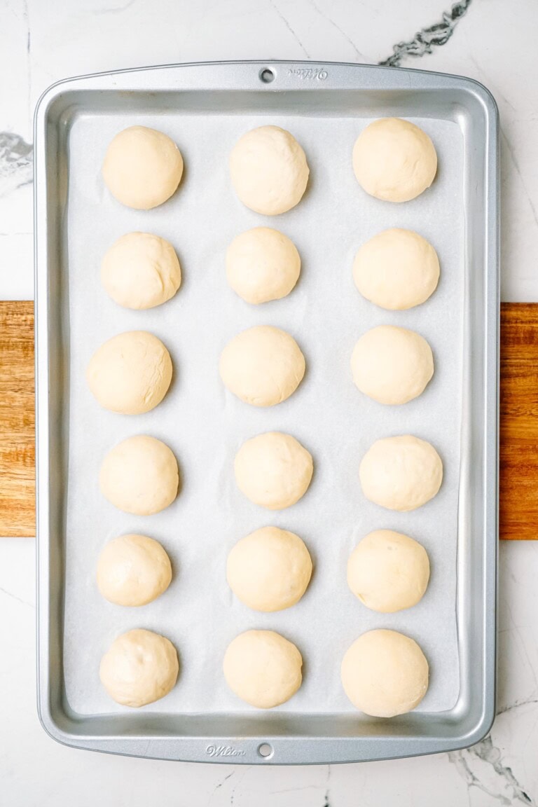 dough balls evenly spaced on a baking sheet