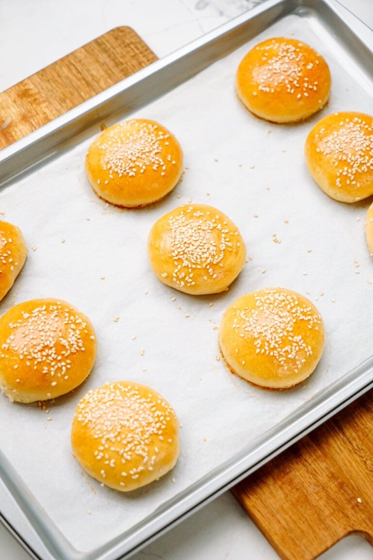 baked slider buns on a baking sheet