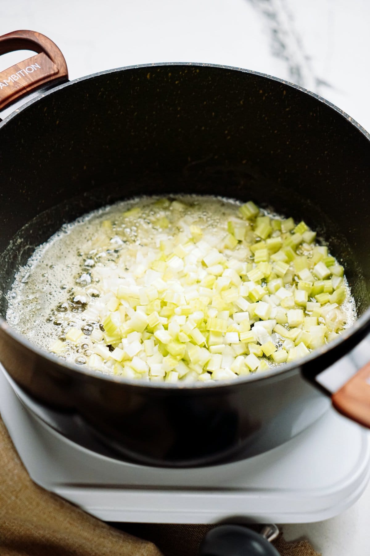 onions sautéing in a skillet