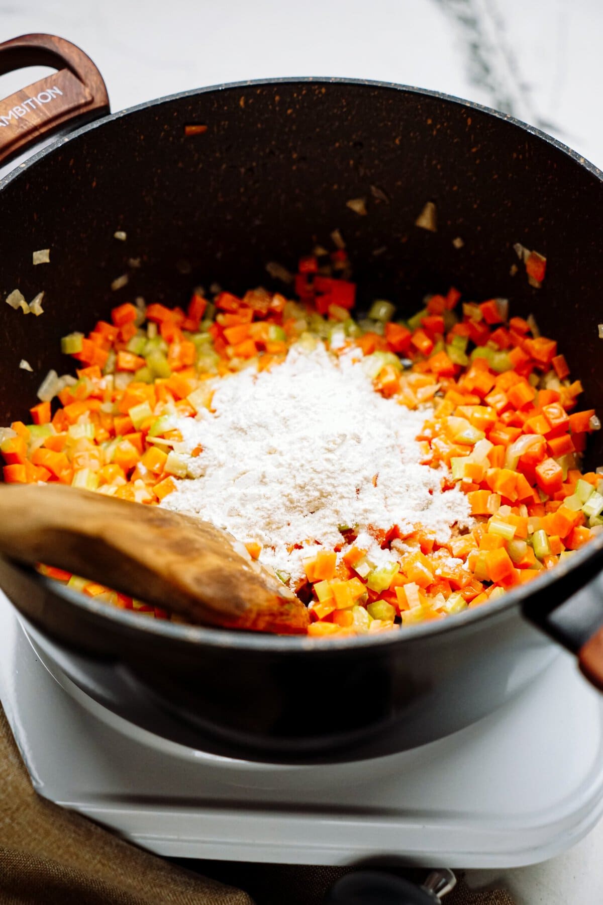 flour added to sauted veggies in a skillet 