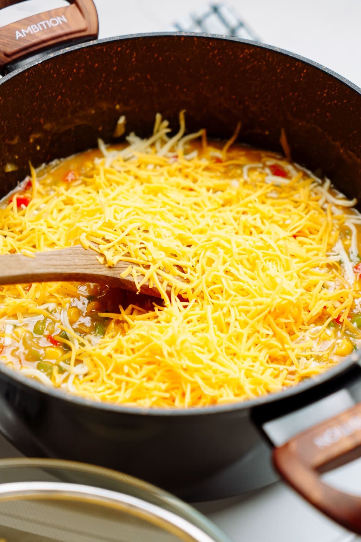shredded cheese added to a veggie mixture