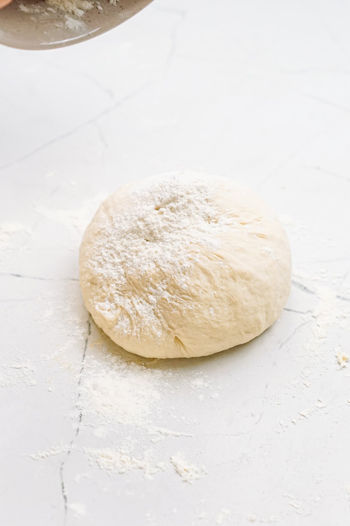 smooth pizza dough in a ball 