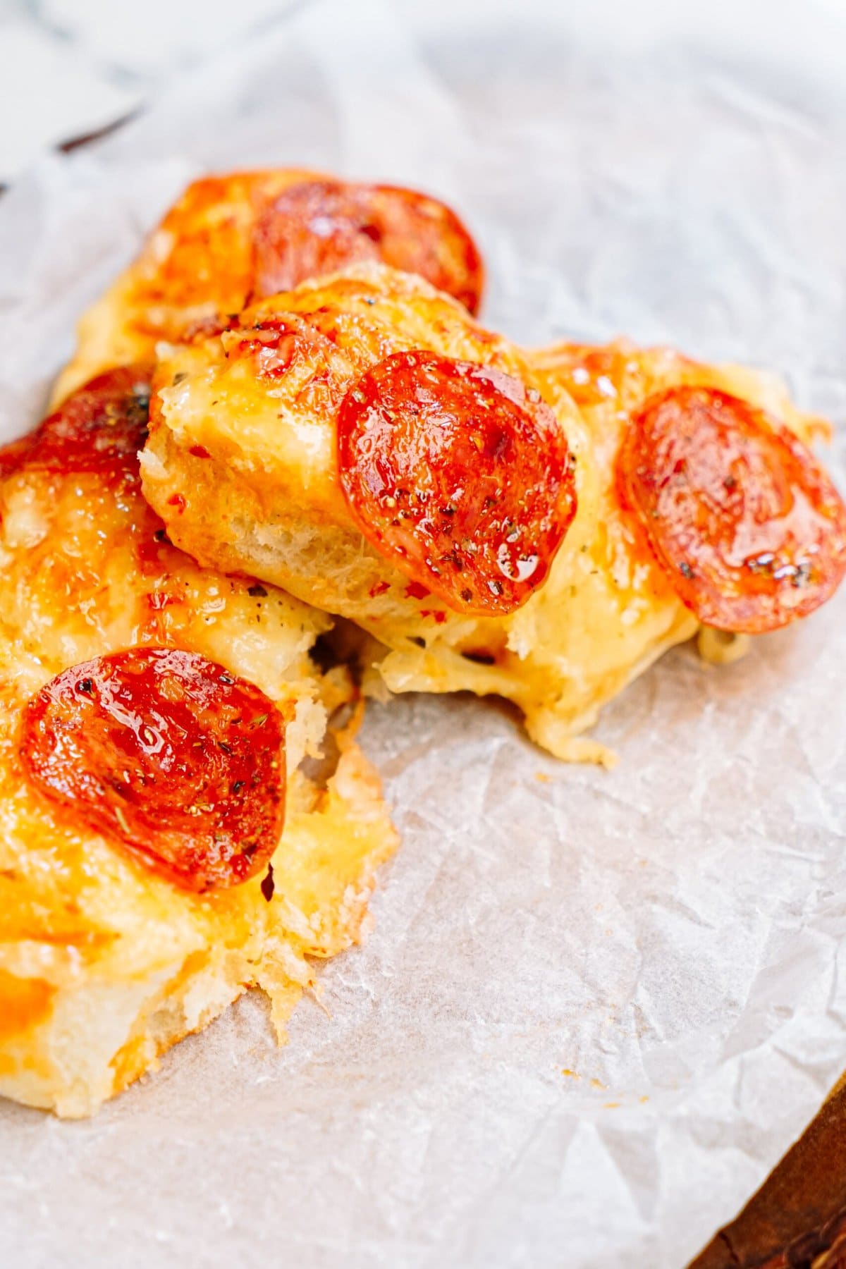 pull apart pizza bread on parchment paper