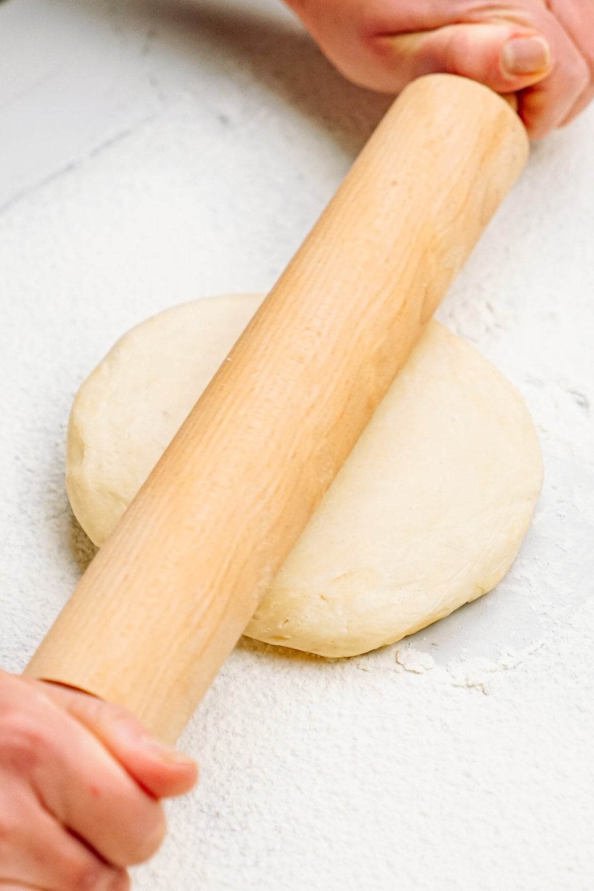 a rolling pin rolling out dough