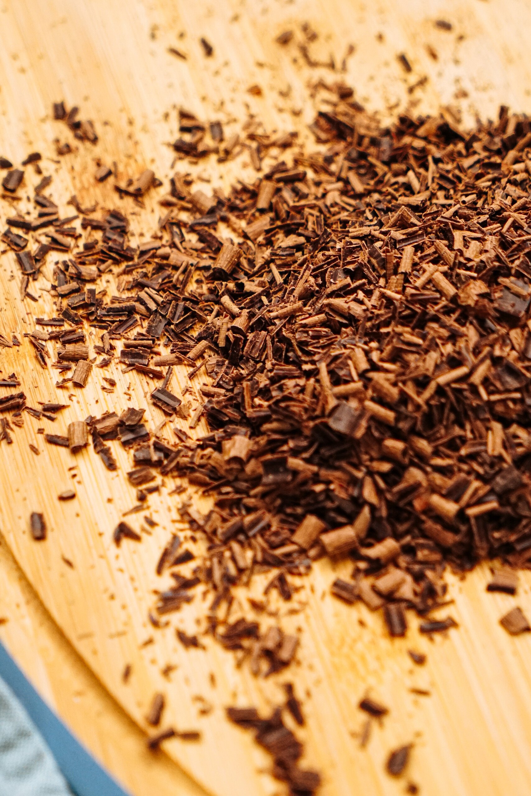 shaved chocolate on wooden cutting board