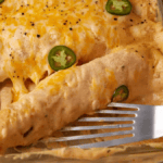 Shrimp Enchiladas With Sour Cream Cheese Sauce. Photo credit Butter and Baggage.