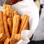 Southern Cheese Straws with Sharp Cheddar Cheese. Photo credit Butter and Baggage.