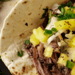 Tender And Juicy Beef Carnitas In A Slow Cooker. Photo credit Butter and Baggage.