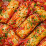 cooked cabbage rolls in dutch oven with fresh parsley