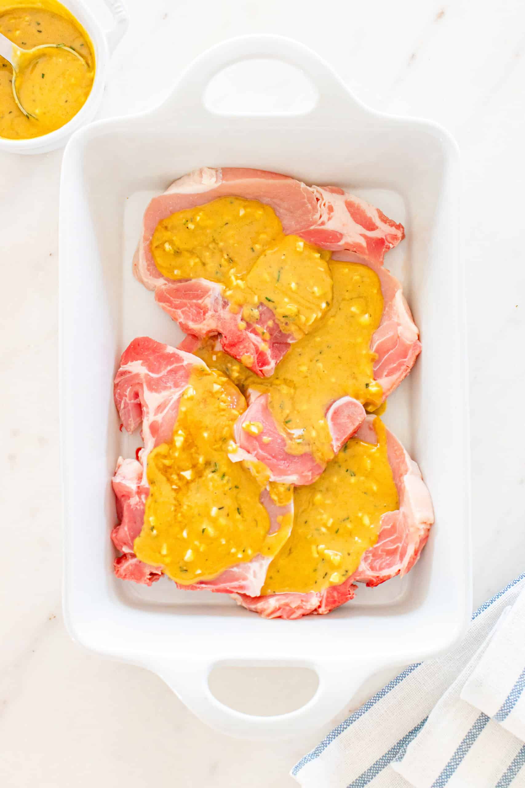 Delicious pork chops drizzled with a tangy mustard sauce for a flavorful dinner.