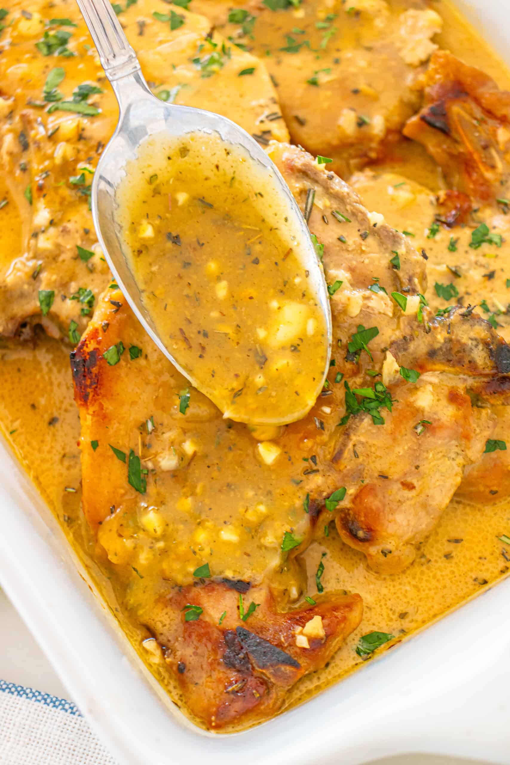 A delicious creamy chicken dish served with corn, herbs and a flavorful sauce.
