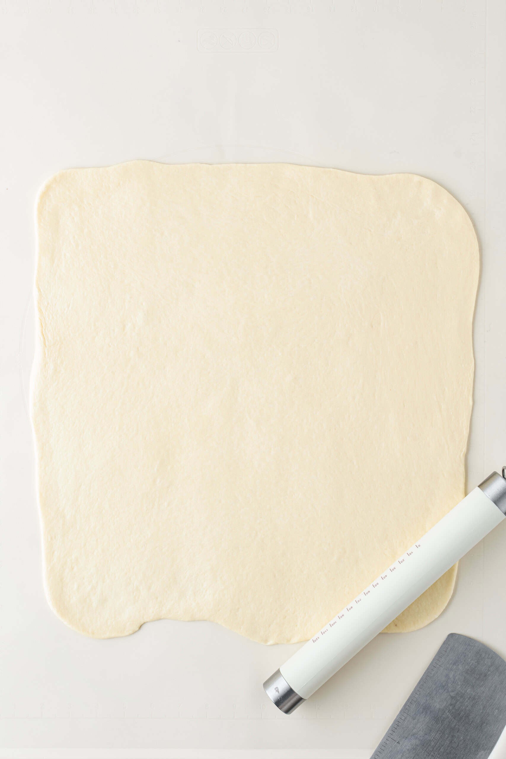 Apple fritter dough rolled into a large rectangle
