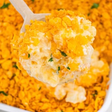 Funeral potatoes topped with crispy cornflake crust and creamy cheesy potato filling