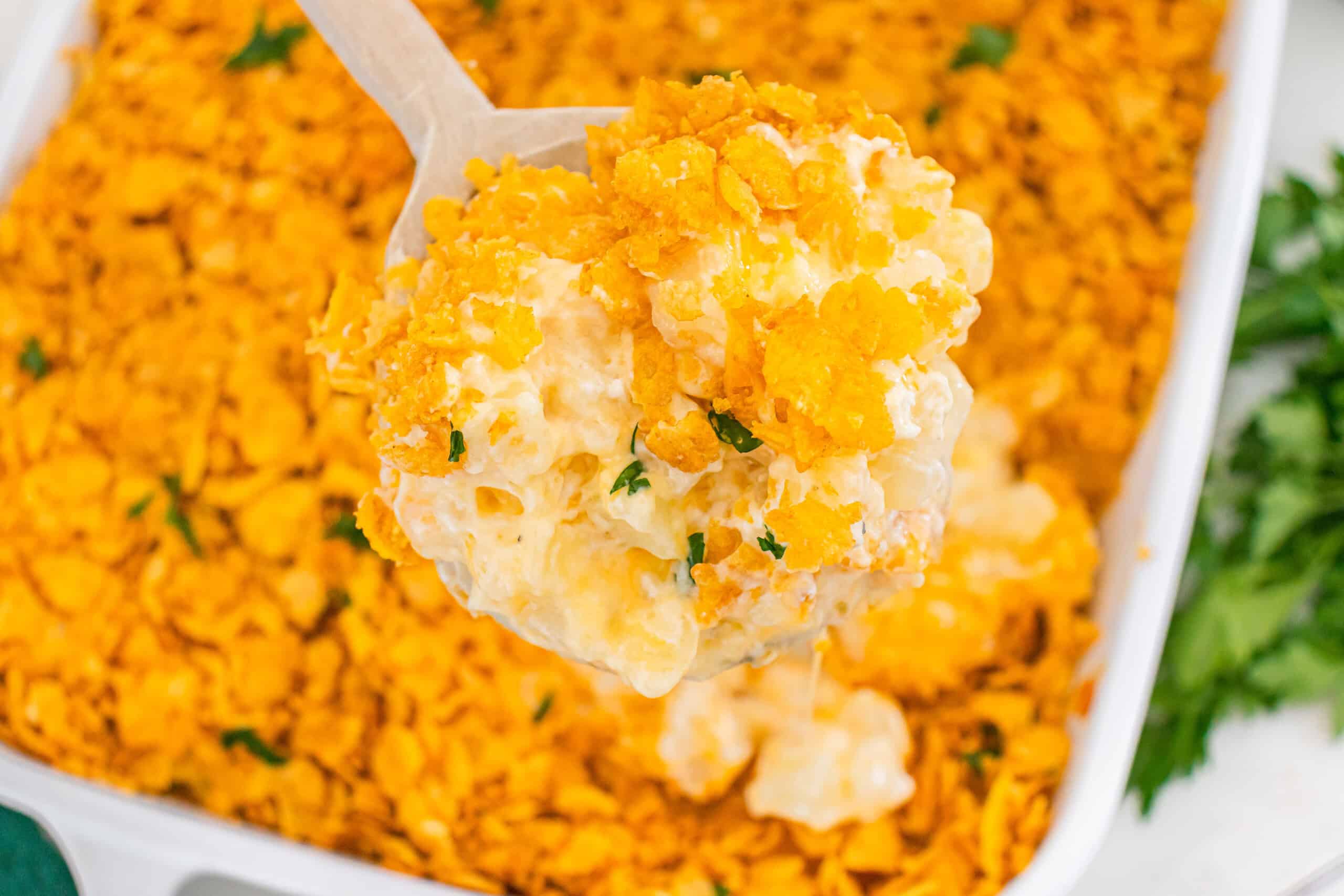 Funeral potatoes topped with crispy cornflake crust and creamy cheesy potato filling