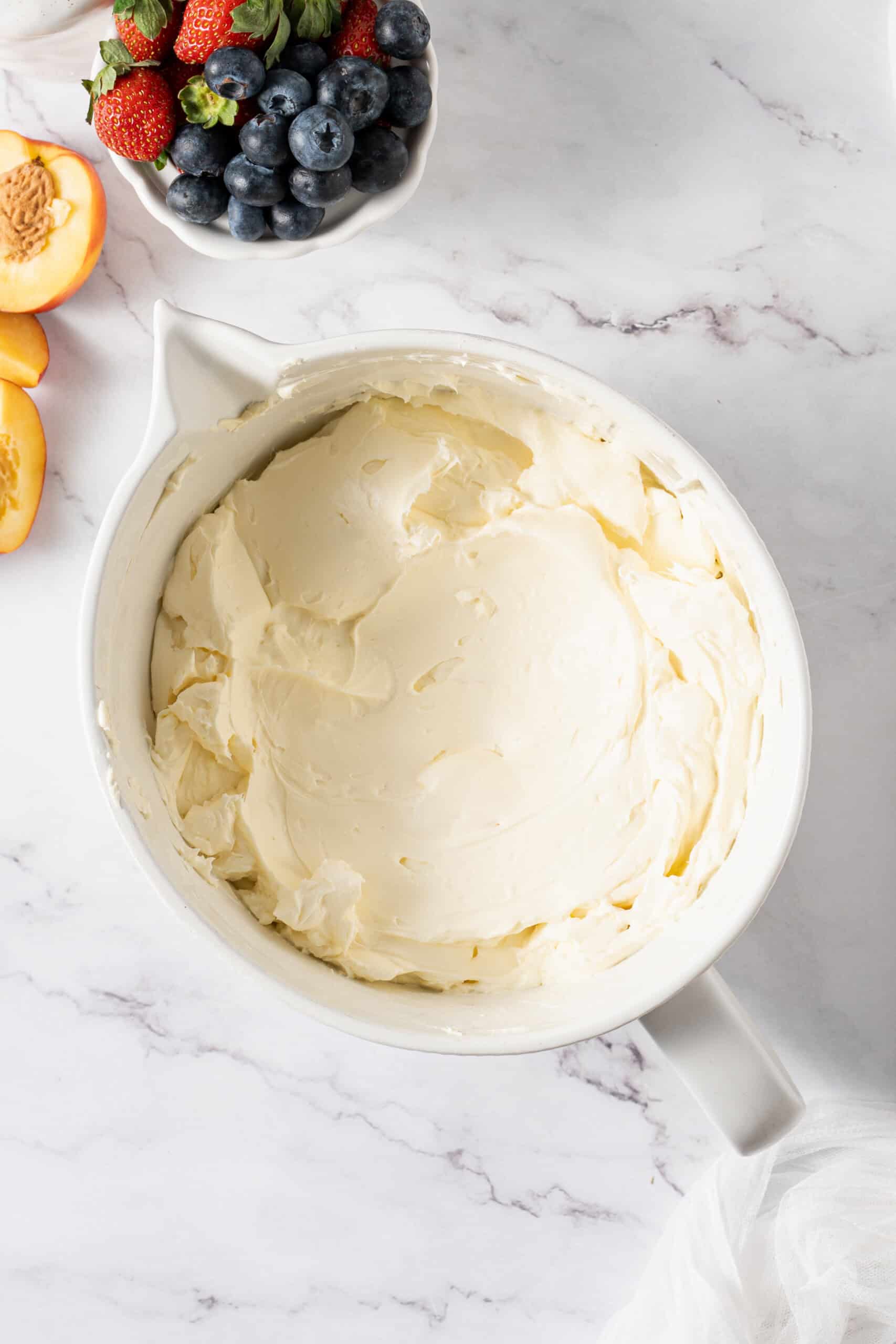 Smooth cheesecake filling mixed in a bowl