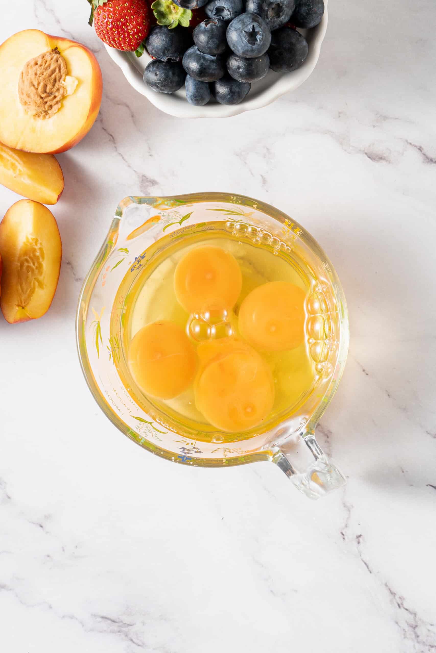 Four eggs in a measuring cup
