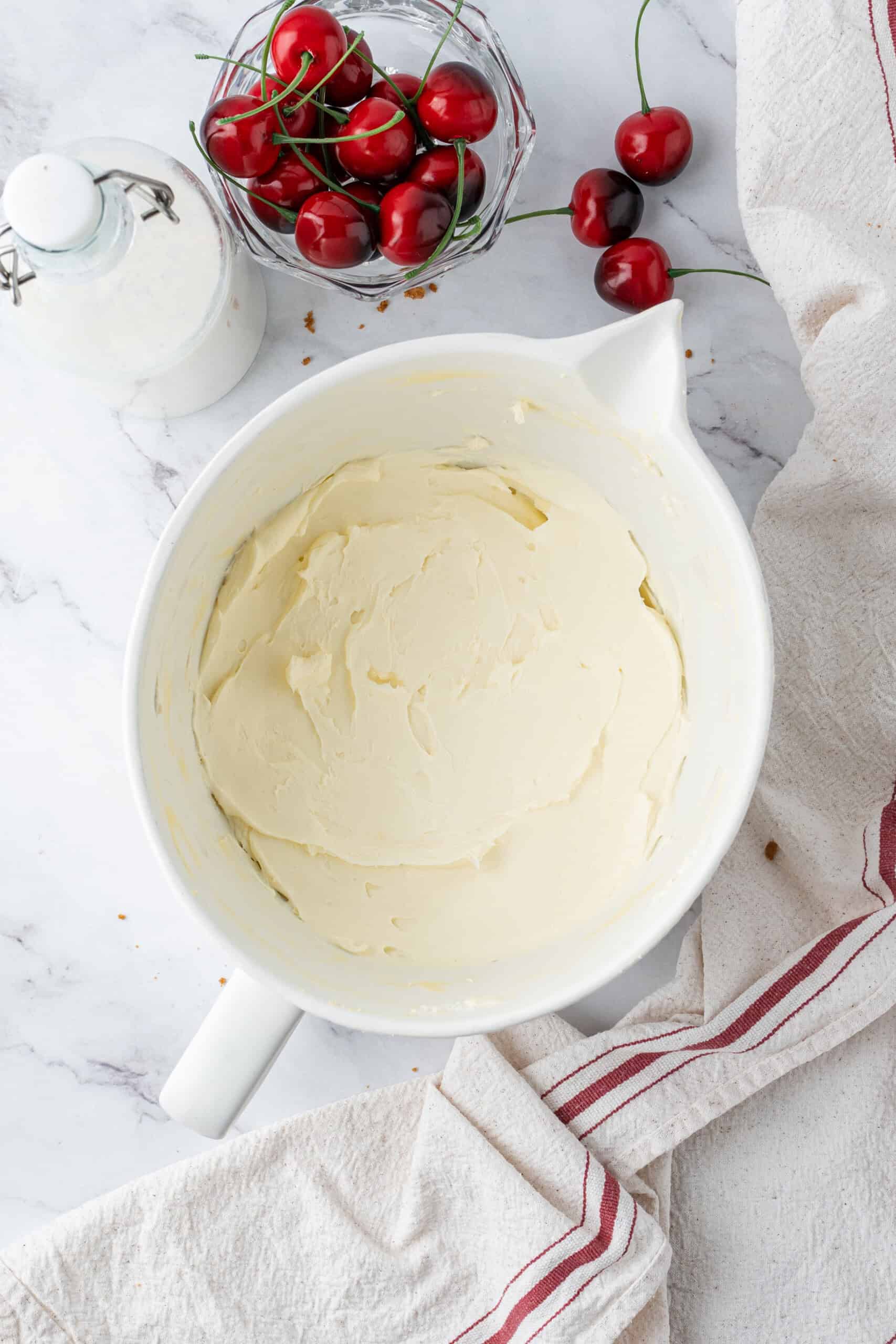 Smooth cream cheese mixture in a mixing bowl, ready for the next ingredient.
