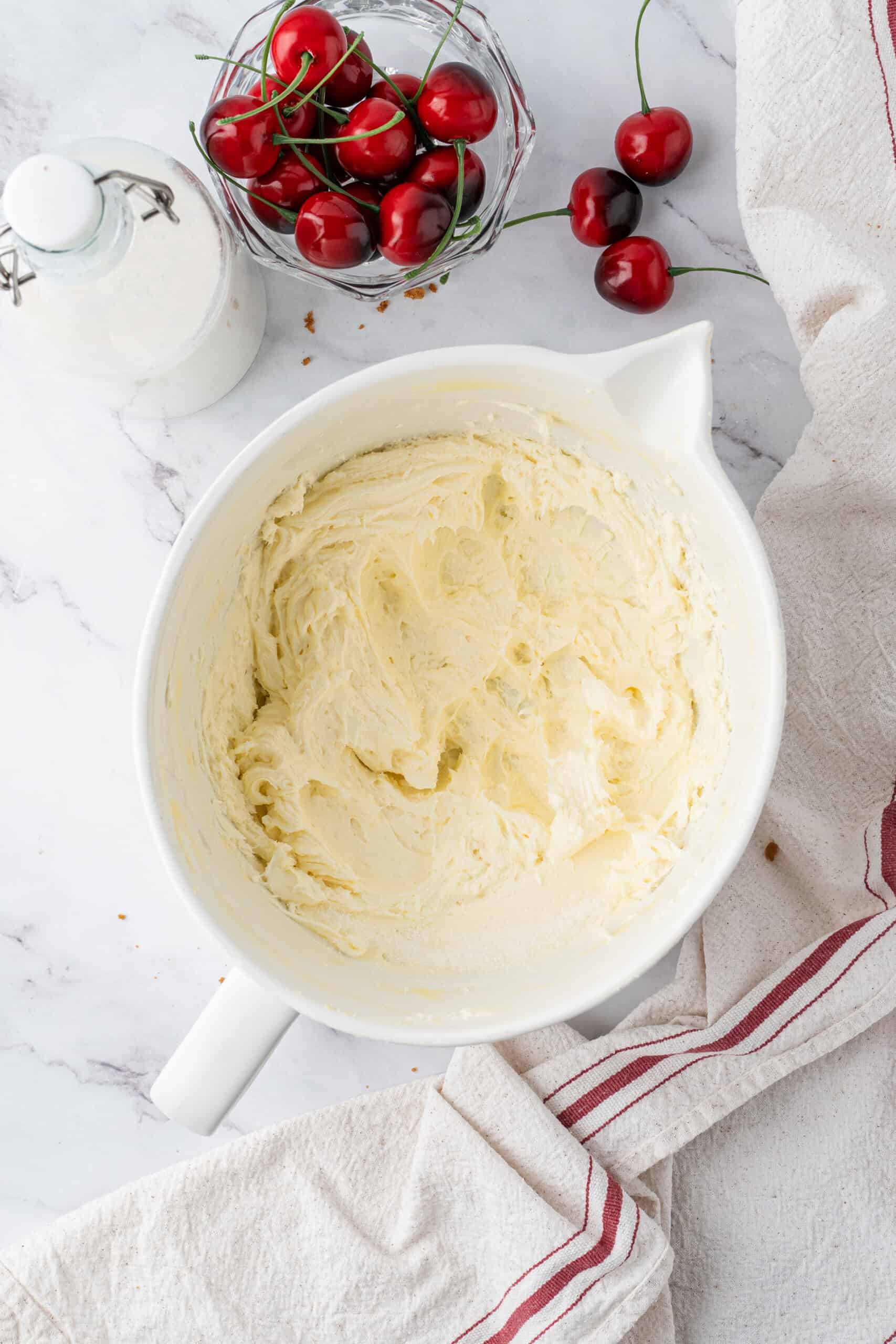Beaten cream cheese and sugar mixture in a mixing bowl