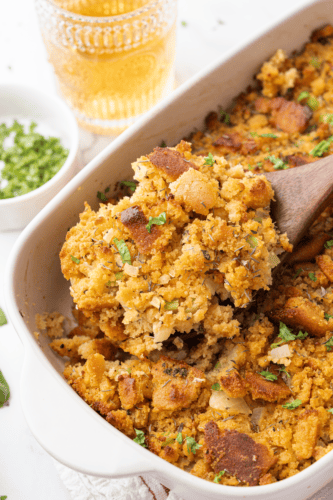 Golden cornbread stuffing served from a casserole dish.