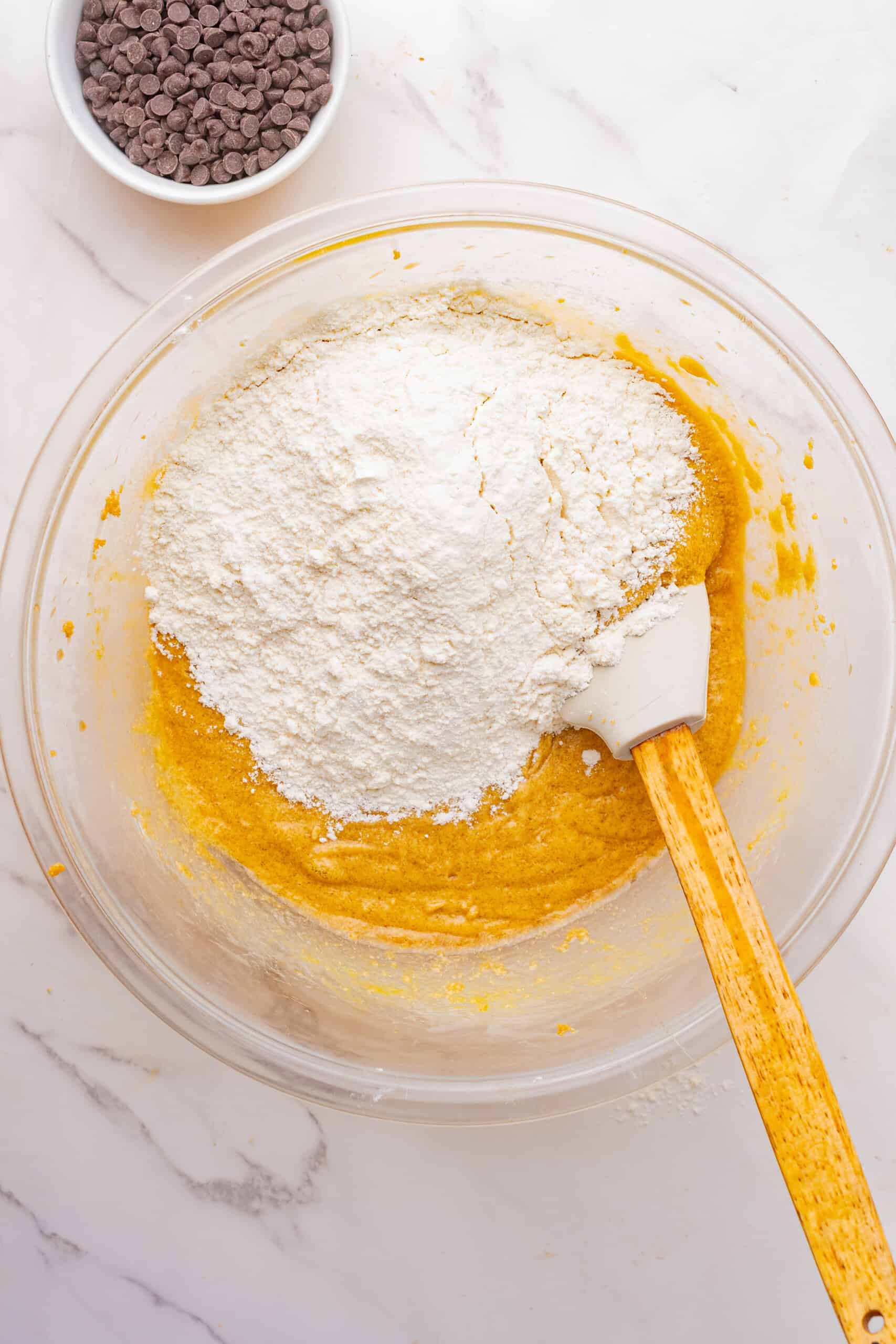Flour added to the cookie dough mixture.