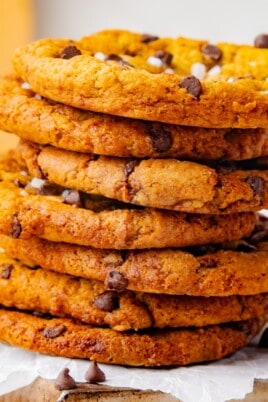 Stack of maple cookies topped with chocolate chips and flaky sea salt