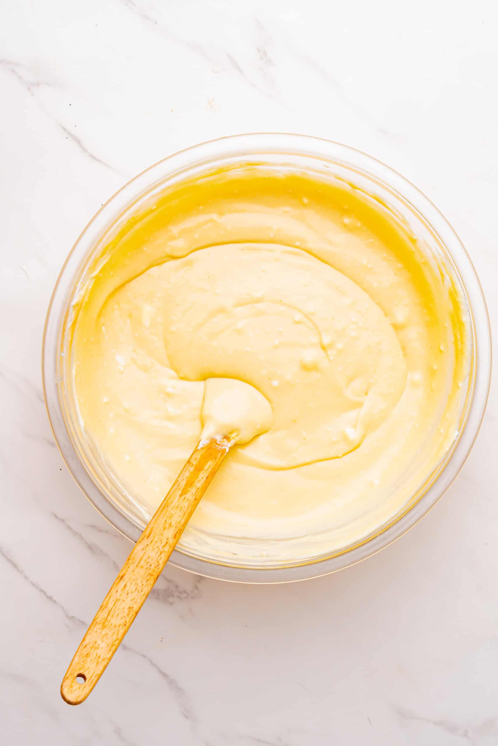 Irish cream cheesecake filling mixed until smooth in a glass bowl.