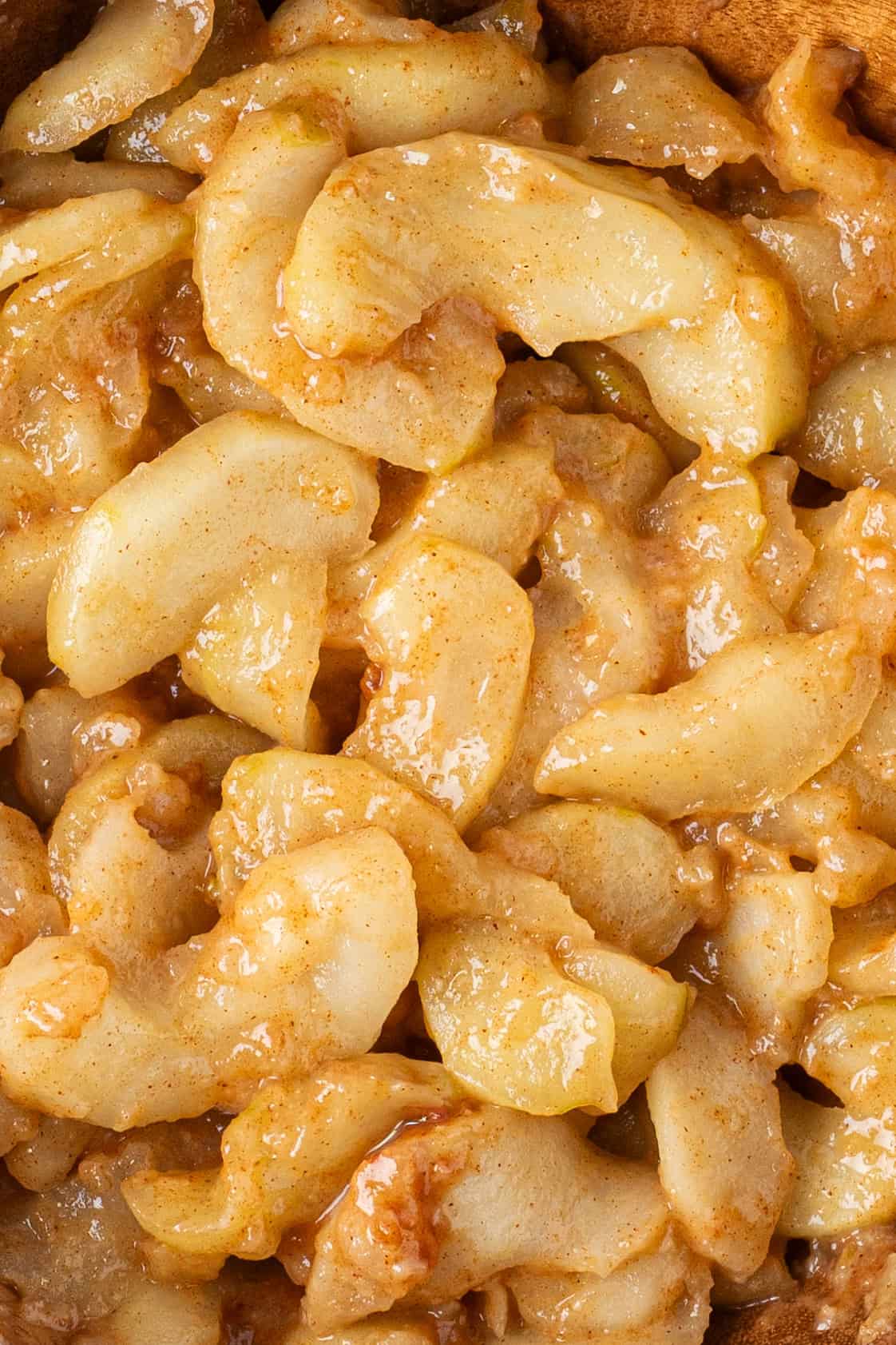 tender apple slices coated in a glossy cinnamon sauce.