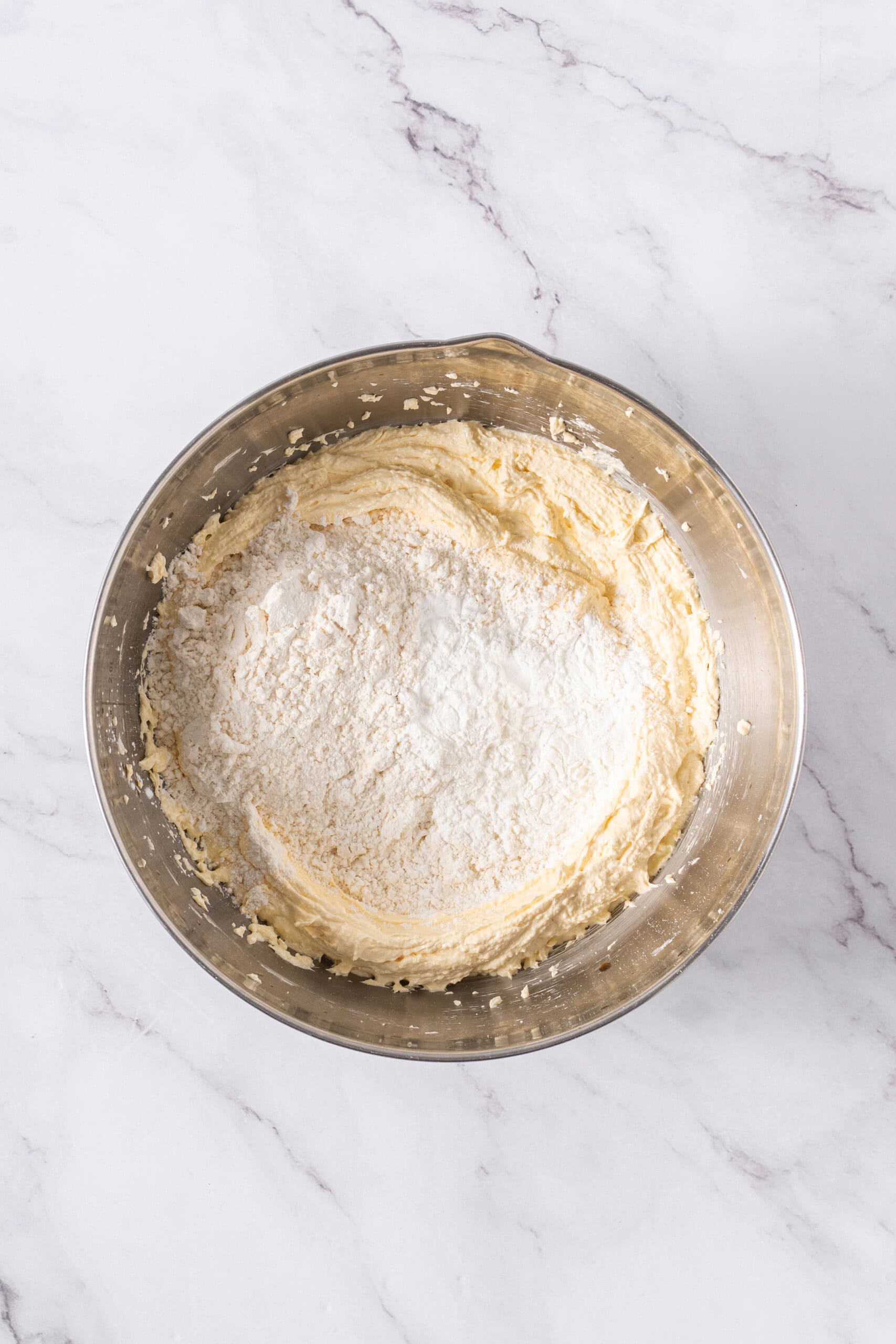 All-purpose flour added to the butter cookie mixture.