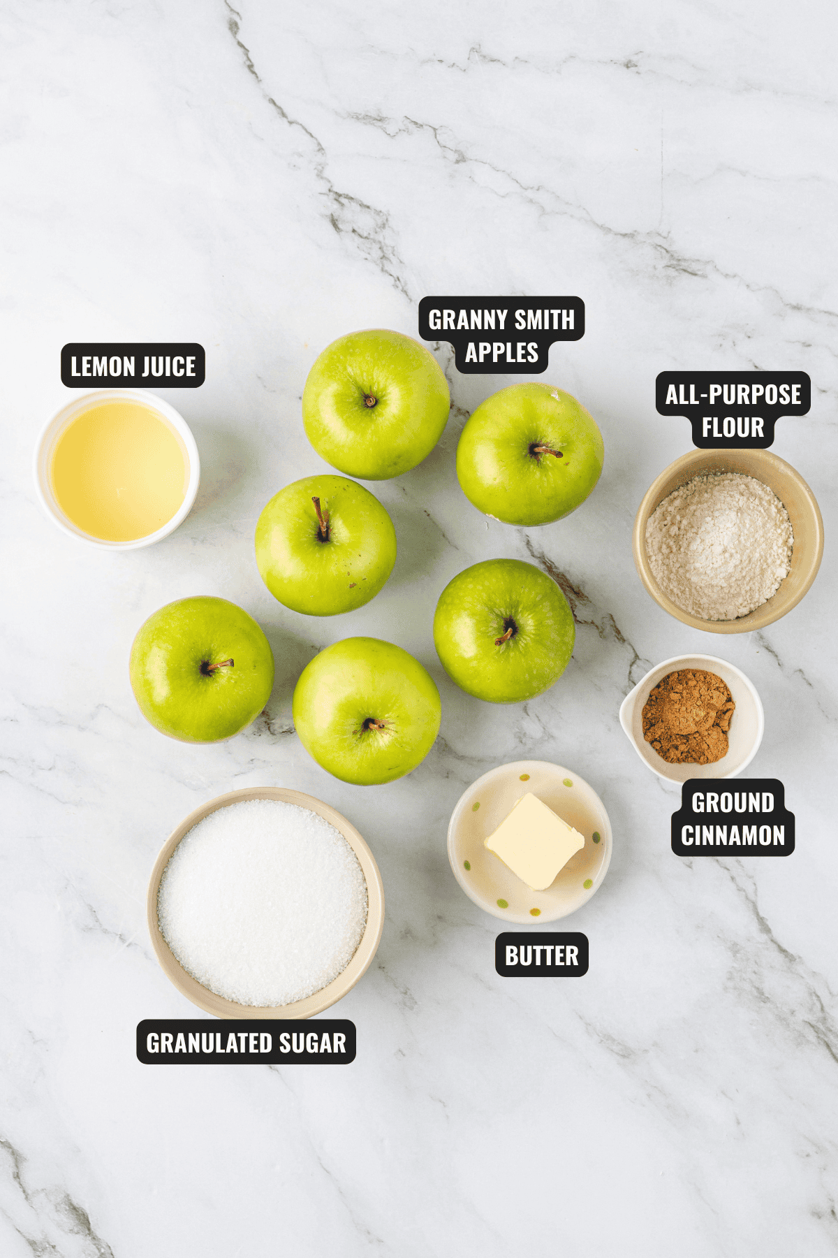ingredients for apple pie filling recipe including apples, lemon juice, all-purpose flour, granulated sugar, butter and, ground cinnamon