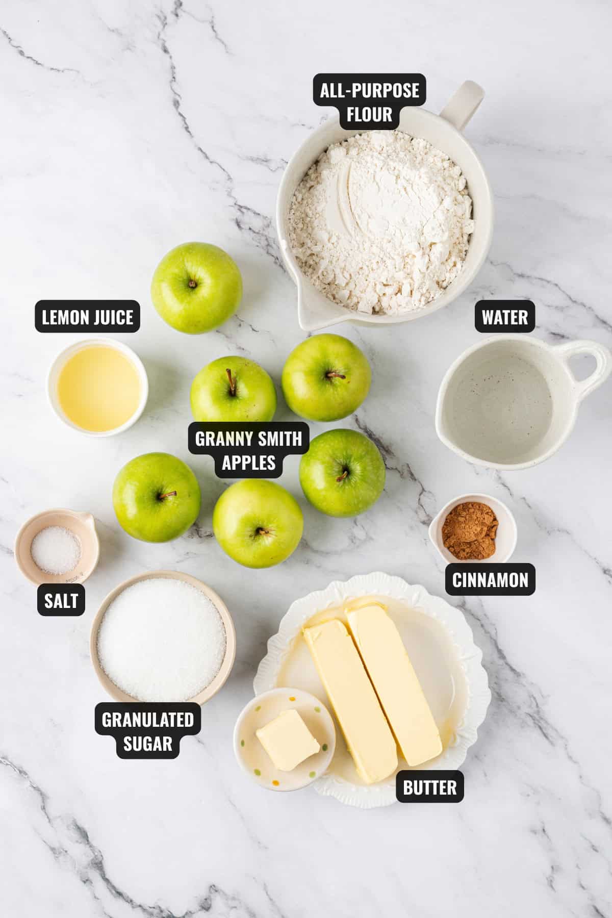 ingredients for apple pie recipe including apples, lemon juice, all-purpose flour, granulated sugar, butter, salt, and, ground cinnamon,